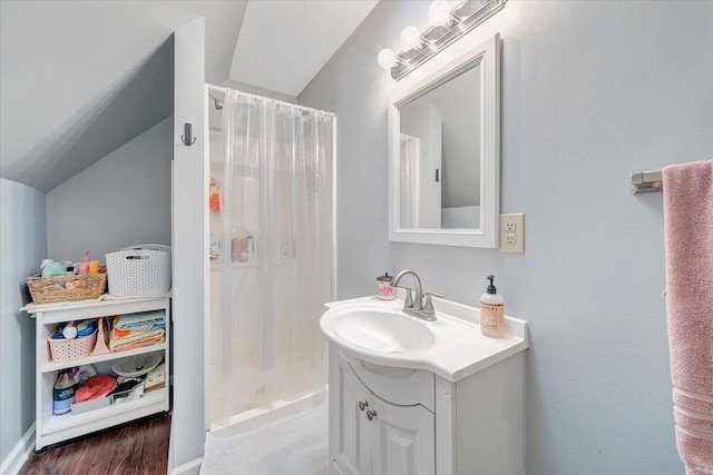 1028 Park Mountain Ter, Huddleston, VA 24104 - bathroom with vanity, vaulted ceiling, a shower stall, and baseboards
