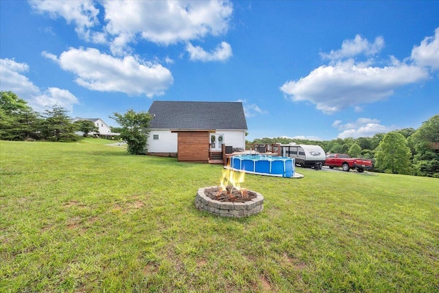 1028 Park Mountain Ter, Huddleston, VA 24104 - view of green lawn featuring an outdoor pool, a fire pit, and a wooden deck