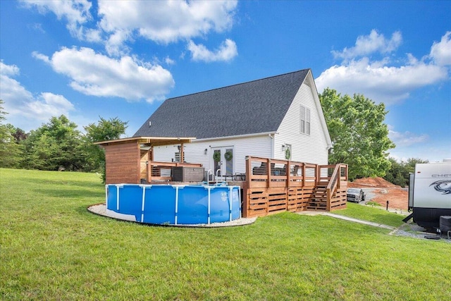 1028 Park Mountain Ter, Huddleston, VA 24104 - rear view of property featuring a wooden deck, an outdoor pool, a lawn, stairway, and a shingled roof