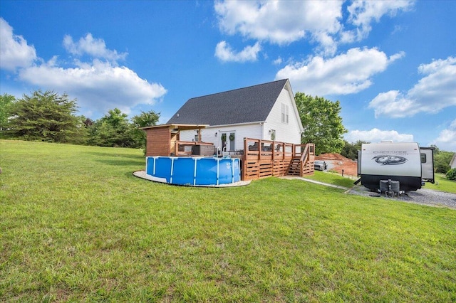 1028 Park Mountain Ter, Huddleston, VA 24104 - back of property with a wooden deck, an outdoor pool, and a lawn