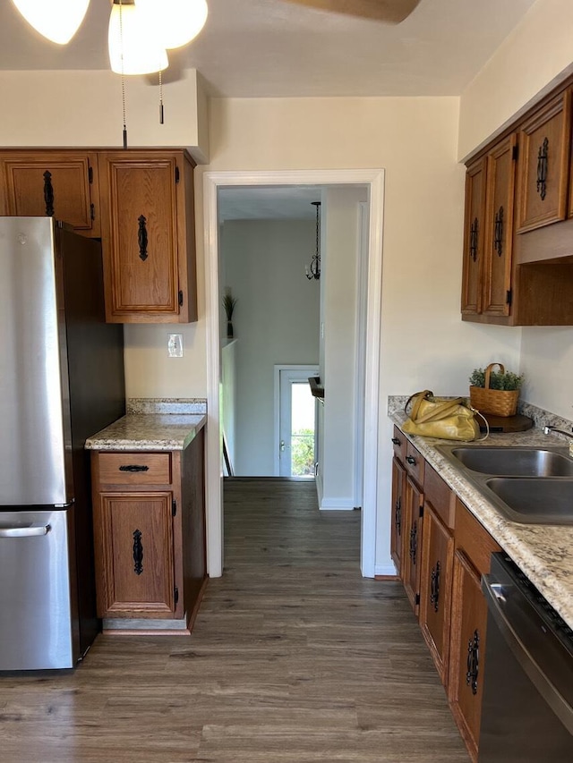 1878 Cranwell Dr, Vinton, VA 24179 - kitchen featuring dishwasher, a sink, freestanding refrigerator, and light countertops