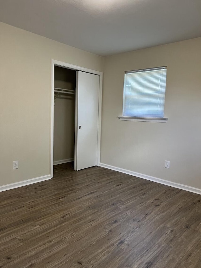 1878 Cranwell Dr, Vinton, VA 24179 - unfurnished bedroom with dark wood finished floors, baseboards, and a closet