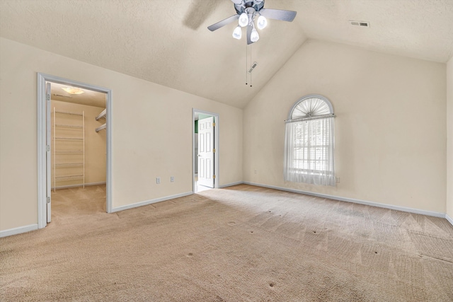 1801 Meadows Ct, Vinton, VA 24179 - unfurnished bedroom featuring carpet floors, a walk in closet, vaulted ceiling, baseboards, and a textured ceiling