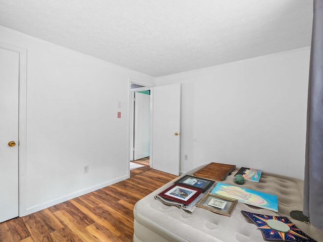 6357 Breckinridge Mill Rd, Fincastle, VA 24090 - office area featuring wood finished floors, crown molding, baseboards, and a textured ceiling