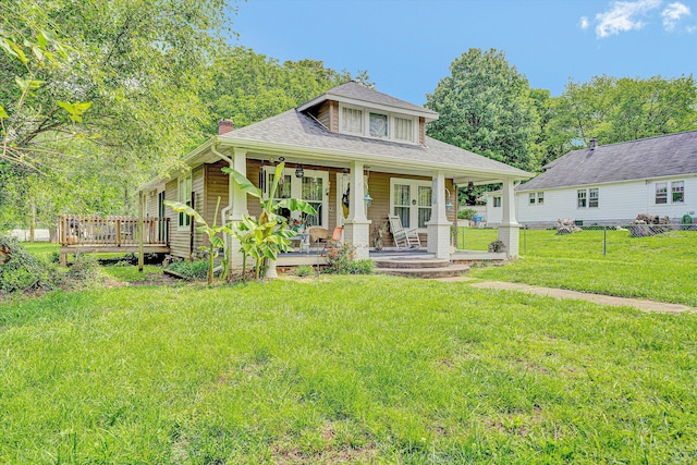 1514 Redwood Rd SE, Roanoke, VA 24014 - bungalow-style home featuring a front yard, a chimney, a shingled roof, and covered porch