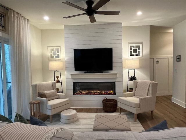 844 Lakewatch Cir, Moneta, VA 24121 - living room with wood finished floors, a ceiling fan, a large fireplace, and recessed lighting