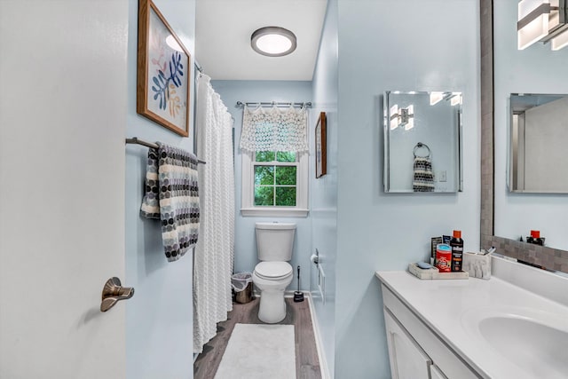 2440 Charing Cross Dr, Roanoke, VA 24018 - bathroom with wood finished floors, vanity, toilet, and baseboards