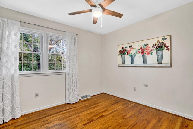 2440 Charing Cross Dr, Roanoke, VA 24018 - spare room featuring wood finished floors, baseboards, and ceiling fan