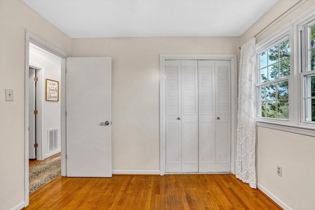 2440 Charing Cross Dr, Roanoke, VA 24018 - unfurnished bedroom featuring wood finished floors, baseboards, and a closet