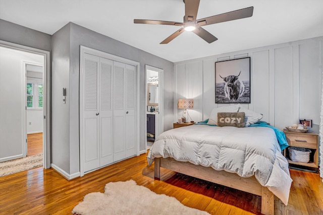 2440 Charing Cross Dr, Roanoke, VA 24018 - bedroom with wood finished floors, ceiling fan, baseboards, a closet, and ensuite bath