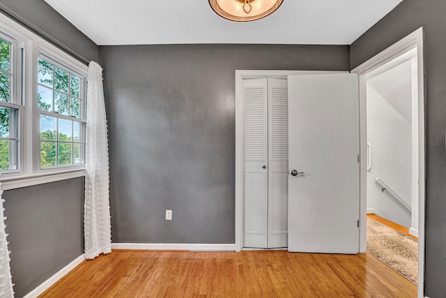 2440 Charing Cross Dr, Roanoke, VA 24018 - unfurnished bedroom featuring wood finished floors, baseboards, and a closet