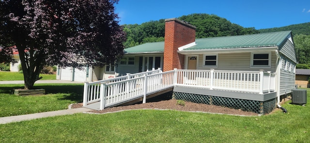 3008 Valley Ridge Rd, Covington, VA 24426 - view of front of property featuring a chimney, central air condition unit, a front lawn, metal roof, and covered porch