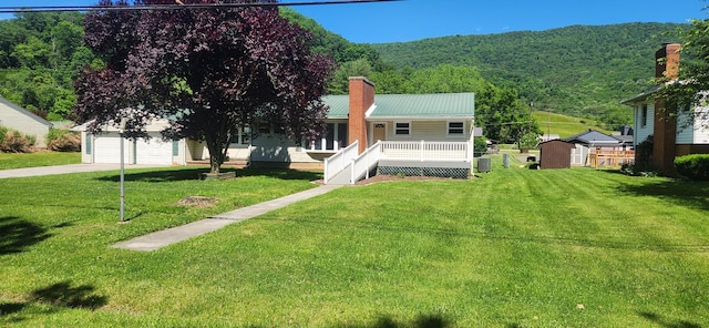 3008 Valley Ridge Rd, Covington, VA 24426 - view of front of home featuring a garage, a front yard, a chimney, and an outdoor structure