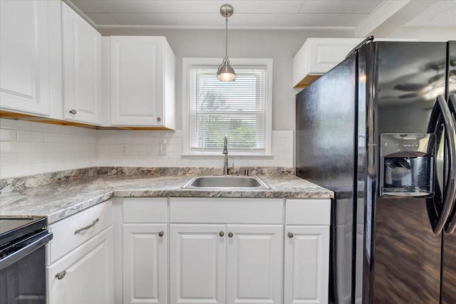 1006 10th St, Glasgow, VA 24555 - kitchen featuring black appliances, a sink, white cabinets, tasteful backsplash, and hanging light fixtures