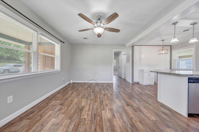 1006 10th St, Glasgow, VA 24555 - kitchen featuring stainless steel dishwasher, white cabinetry, baseboards, wood finished floors, and ceiling fan
