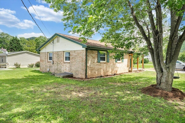 1006 10th St, Glasgow, VA 24555 - view of side of property featuring brick siding and a yard