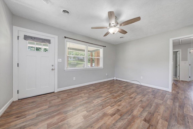 1006 10th St, Glasgow, VA 24555 - entryway with wood finished floors, baseboards, ceiling fan, and a textured ceiling
