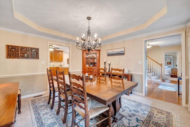 610 Crystal Anne Ln, Roanoke, VA 24019 - dining area featuring a raised ceiling, stairs, a chandelier, crown molding, and baseboards
