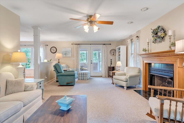 610 Crystal Anne Ln, Roanoke, VA 24019 - carpeted living room featuring plenty of natural light, french doors, a fireplace with flush hearth, and ceiling fan