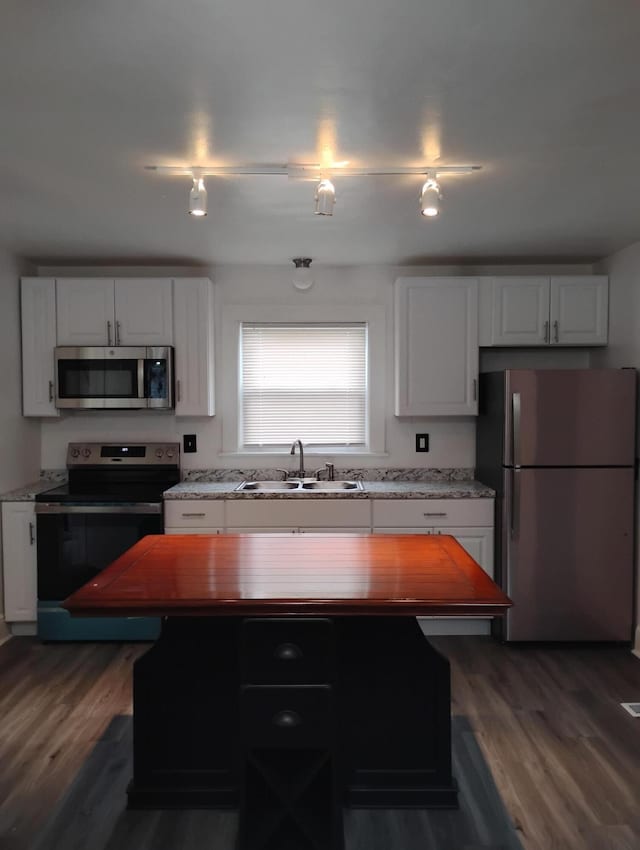 1414 Westside Blvd NW, Roanoke, VA 24017 - kitchen featuring stainless steel appliances, a sink, dark wood-style flooring, and white cabinetry