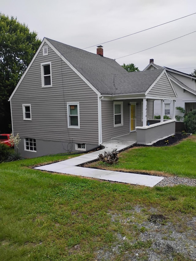 1414 Westside Blvd NW, Roanoke, VA 24017 - back of house featuring roof with shingles, a yard, a chimney, and a porch