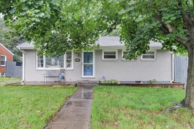 3023 Birchlawn Ave NW, Roanoke, VA 24012 - view of front of property featuring brick siding, a front lawn, and roof with shingles