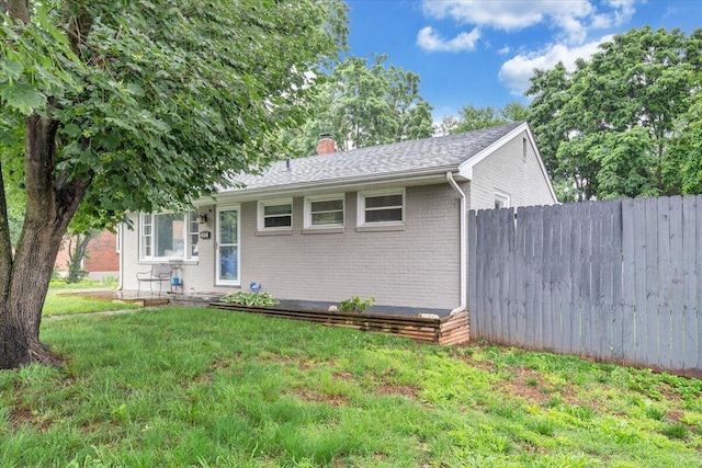 3023 Birchlawn Ave NW, Roanoke, VA 24012 - ranch-style house featuring a chimney, brick siding, and a shingled roof