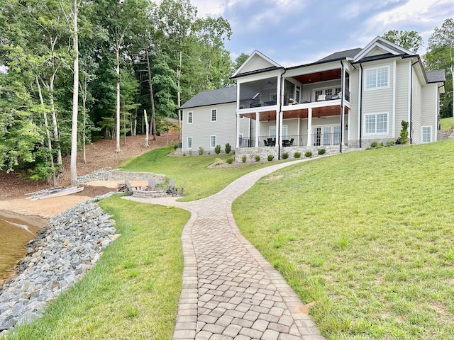 1115 Oakshire Ln, Wirtz, VA 24184 - back of property with ceiling fan, a balcony, a lawn, and a patio area