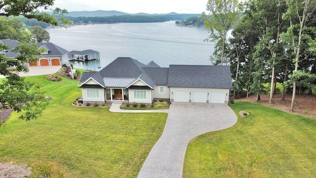 1115 Oakshire Ln, Wirtz, VA 24184 - view of front of property featuring a garage, driveway, a water and mountain view, and a front lawn