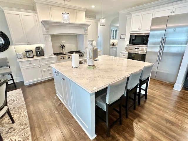1115 Oakshire Ln, Wirtz, VA 24184 - kitchen with stainless steel appliances, recessed lighting, dark wood finished floors, white cabinets, and light stone counters