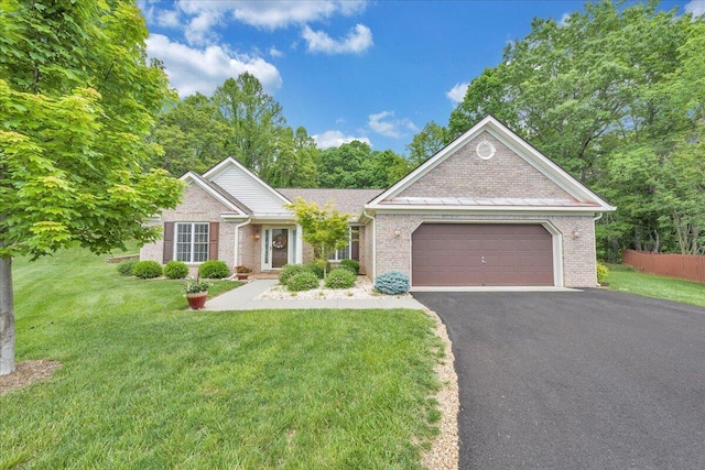 6560 Monet Dr, Roanoke, VA 24018 - ranch-style home featuring asphalt driveway, an attached garage, a front yard, and brick siding