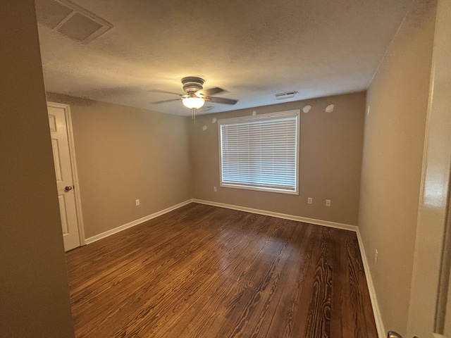 120 Nyle Ridge Rd, Wirtz, VA 24184 - empty room with ceiling fan, dark wood-style flooring, and a textured ceiling