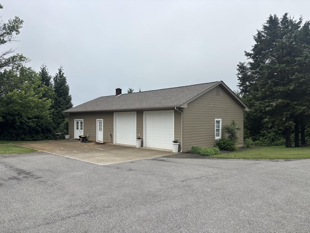 120 Nyle Ridge Rd, Wirtz, VA 24184 - view of side of property featuring a detached garage and a chimney