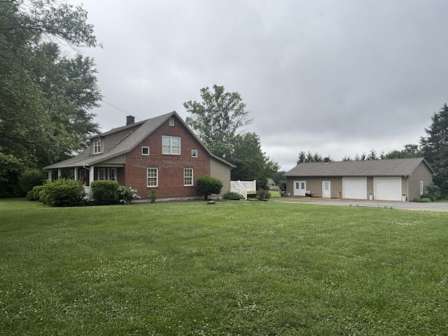 120 Nyle Ridge Rd, Wirtz, VA 24184 - view of home's exterior featuring brick siding, a lawn, an outdoor structure, a garage, and a chimney