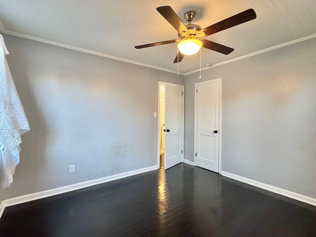 816 Brandon Ave SW, Roanoke, VA 24015 - spare room with dark wood finished floors, a ceiling fan, baseboards, and ornamental molding