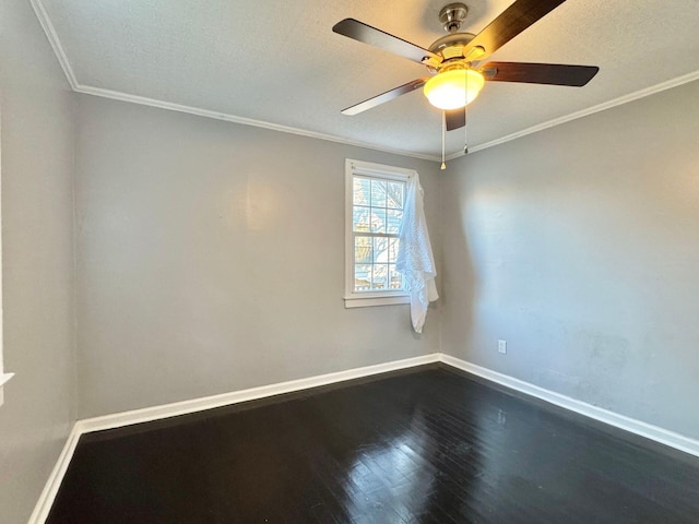 816 Brandon Ave SW, Roanoke, VA 24015 - spare room featuring baseboards, a ceiling fan, dark wood-style floors, a textured ceiling, and ornamental molding