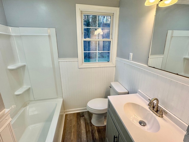 816 Brandon Ave SW, Roanoke, VA 24015 - full bath featuring wainscoting, wood finished floors, vanity, toilet, and baseboards