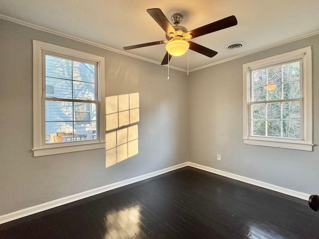 816 Brandon Ave SW, Roanoke, VA 24015 - spare room featuring baseboards, healthy amount of natural light, dark wood-style flooring, crown molding, and ceiling fan