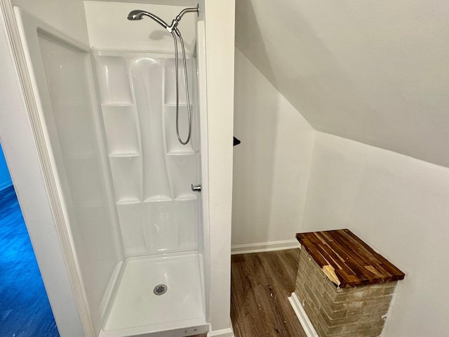 816 Brandon Ave SW, Roanoke, VA 24015 - bathroom with a stall shower, wood finished floors, and baseboards