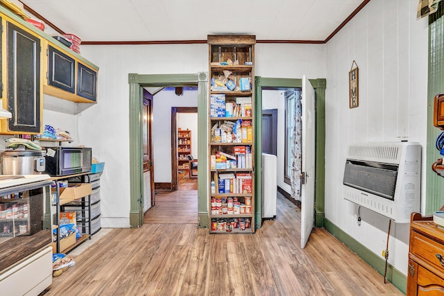 131 Indian Ln, Eagle Rock, VA 24085 - kitchen with heating unit, crown molding, range, light wood-style flooring, and baseboards