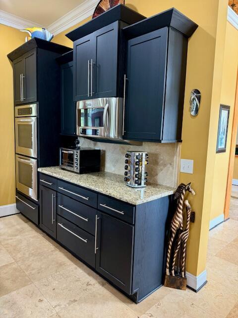 1038 Lees Mill Ln, Goode, VA 24556 - kitchen with ornamental molding, appliances with stainless steel finishes, decorative backsplash, baseboards, and light stone countertops