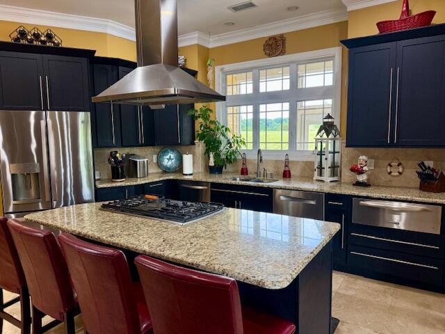 1038 Lees Mill Ln, Goode, VA 24556 - kitchen featuring island exhaust hood, a warming drawer, stainless steel appliances, a sink, and a breakfast bar