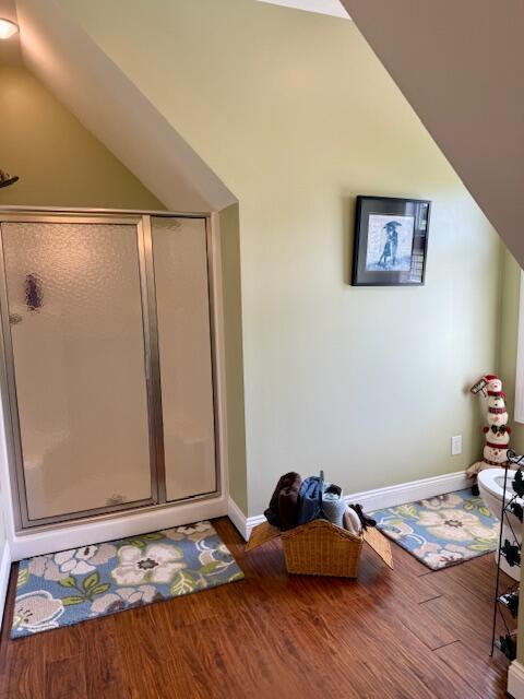 1038 Lees Mill Ln, Goode, VA 24556 - full bath with a stall shower, lofted ceiling, wood finished floors, and baseboards