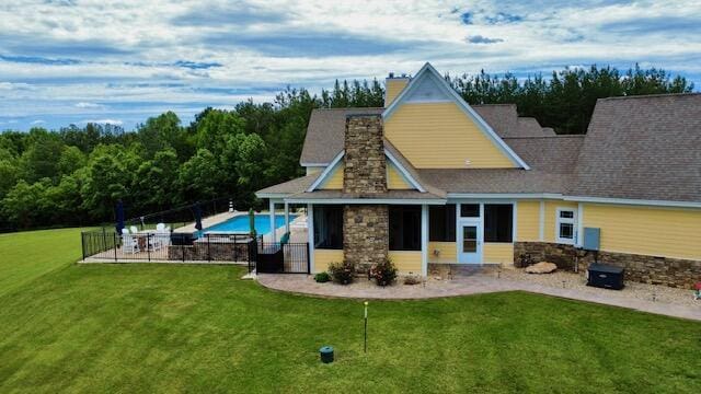1038 Lees Mill Ln, Goode, VA 24556 - back of house featuring a patio area, stone siding, and a chimney