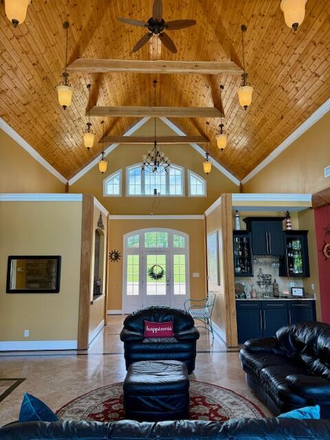 1038 Lees Mill Ln, Goode, VA 24556 - living room featuring wood ceiling with exposed beams, high vaulted ceiling, ceiling fan, baseboards, and a chandelier