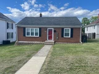 130 W Augusta Ave, Vinton, VA 24179 - view of front of home featuring brick siding, a chimney, a front yard, and entry steps