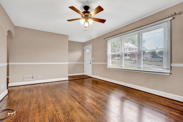 130 W Augusta Ave, Vinton, VA 24179 - empty room featuring wood finished floors, a ceiling fan, baseboards, and arched walkways
