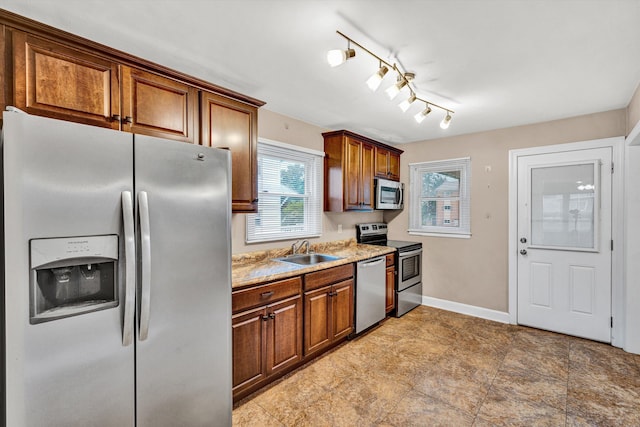 130 W Augusta Ave, Vinton, VA 24179 - kitchen with appliances with stainless steel finishes, a sink, plenty of natural light, and light countertops