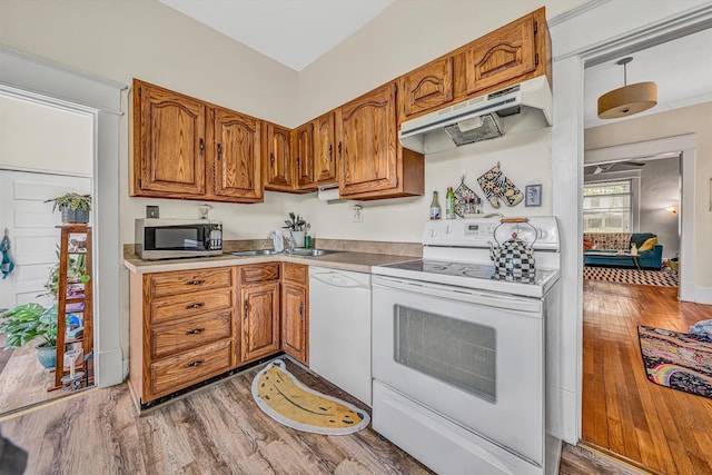 602 Allison Ave SW, Roanoke, VA 24016 - kitchen with white appliances, under cabinet range hood, and brown cabinetry