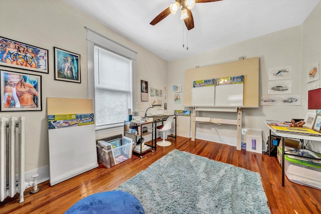 602 Allison Ave SW, Roanoke, VA 24016 - office featuring radiator heating unit, ceiling fan, wood finished floors, and baseboards